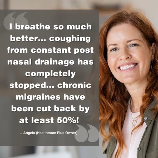 A smiling woman with long red hair stands beside a testimonial that says: Since using the Austin Air Healthmate Plus Air Purifier, I breathe much better—my coughing from post nasal drainage is gone and my chronic migraines have been cut by at least 50%!.