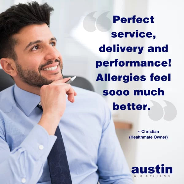 A smiling man in business attire sits at a desk, looking thoughtful. Beside him, a testimonial reads: Perfect service, delivery and performance! My allergies feel sooo much better with my Austin Air Healthmate Air Purifier. Logo: Austin Air Systems.
