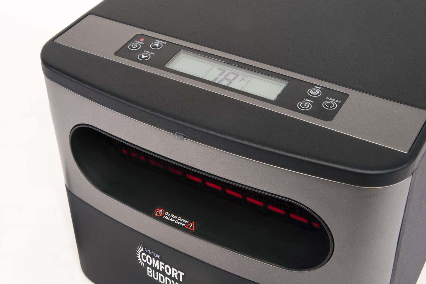 Close-up of a black and gray AirNmore® Comfort Buddy heater with an LED display showing 79°F, multiple control buttons on top, and a visible heater vent with safety warning label below the display.
