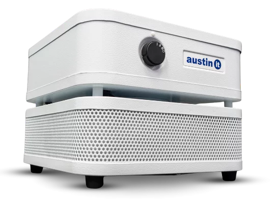 The Austin “it” Air Purifier is a white, box-shaped unit with a perforated lower section, a front control knob, and features the blue Austin “it” logo on the upper front panel.